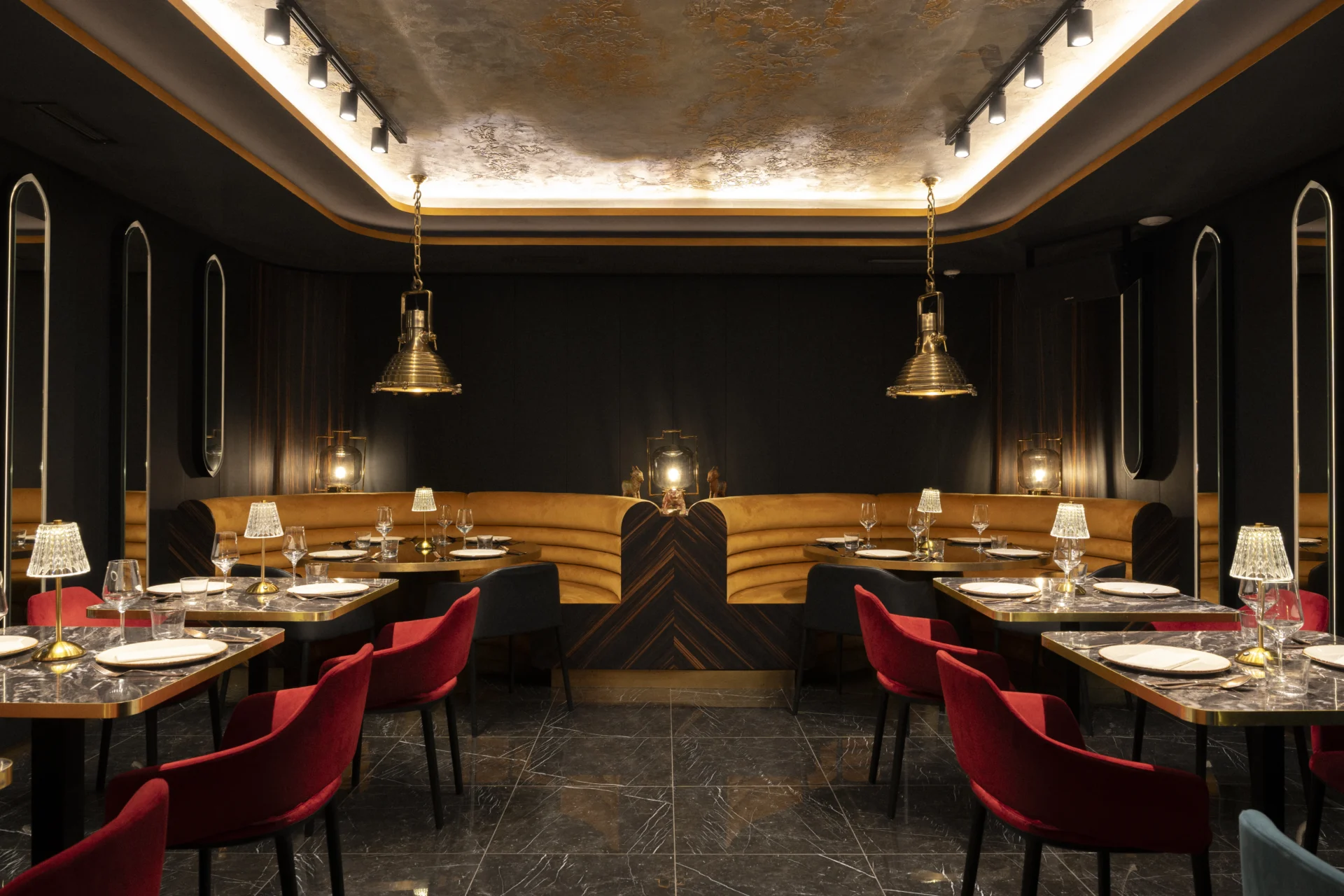 Laid tables in the restaurant, with pendant lights