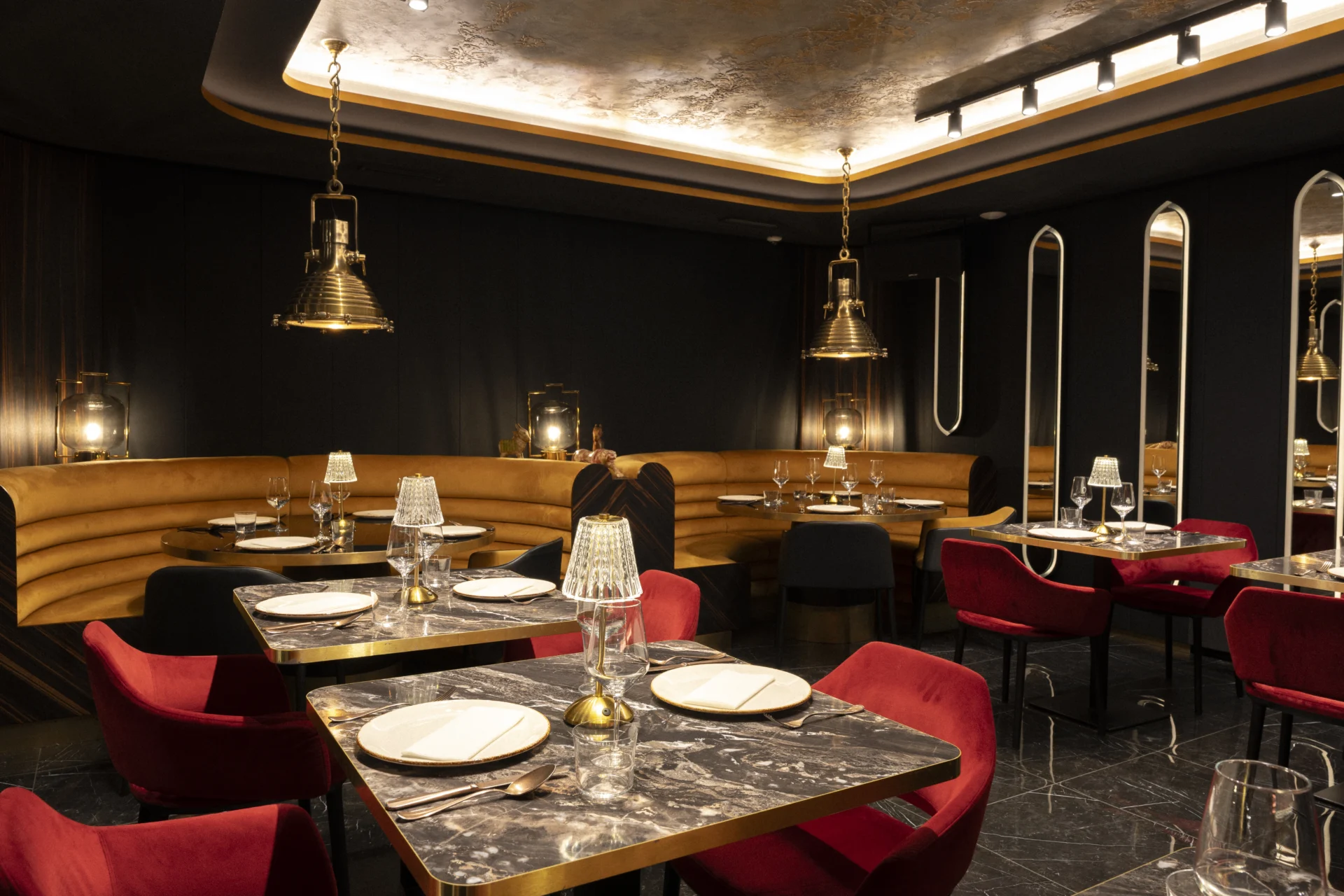 The basement private room with laid tables and pendant lights